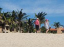 Livingston and Eloise walk in the sand