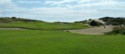 Lots of sand and brush around this green