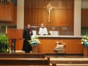 The priest and altar boy prepare
