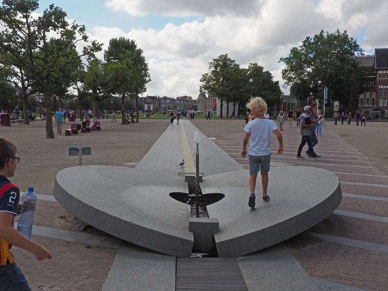 Kids playing on an art installation in the Museumplein park