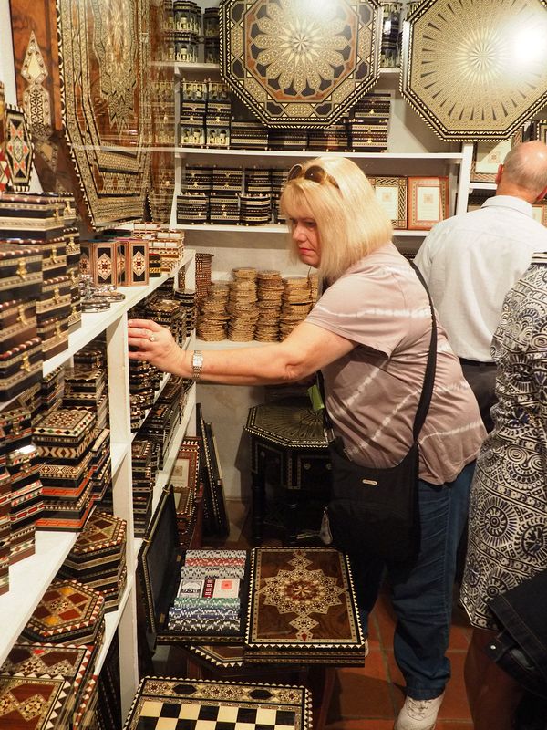 Linda is shopping for inlaid wood