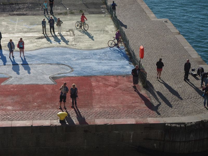 People watching our ship leave port