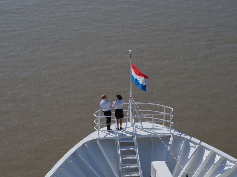Two crew members at the bow of the ship