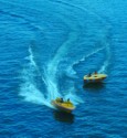 Speedboat towing an inflatable raft