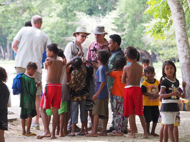 Kids surround some other tourists