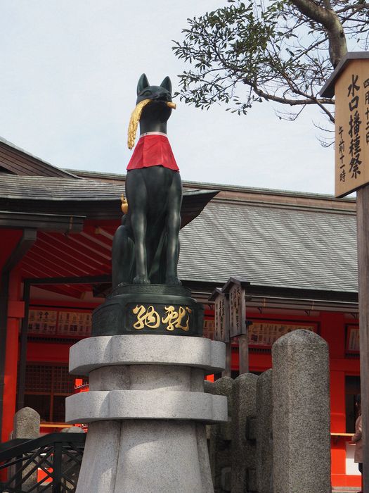 A fox with rice in it's mouth (Inari is the god of rice)