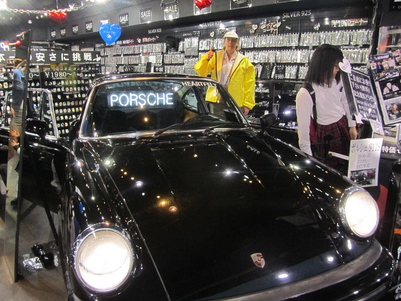 June finds a Porsche inside a store