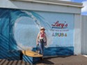 June next to the sign for Lucy's Retired Surfers Bar