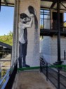Mural of a coffee picker emptyuing a basket