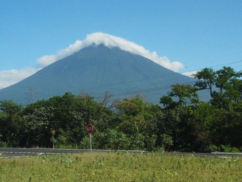 The top of this volcano is covered in clouds