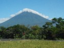 The top of this volcano is covered in clouds
