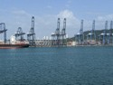 Cargo cranes with Panama City skyscrapers in the distance
