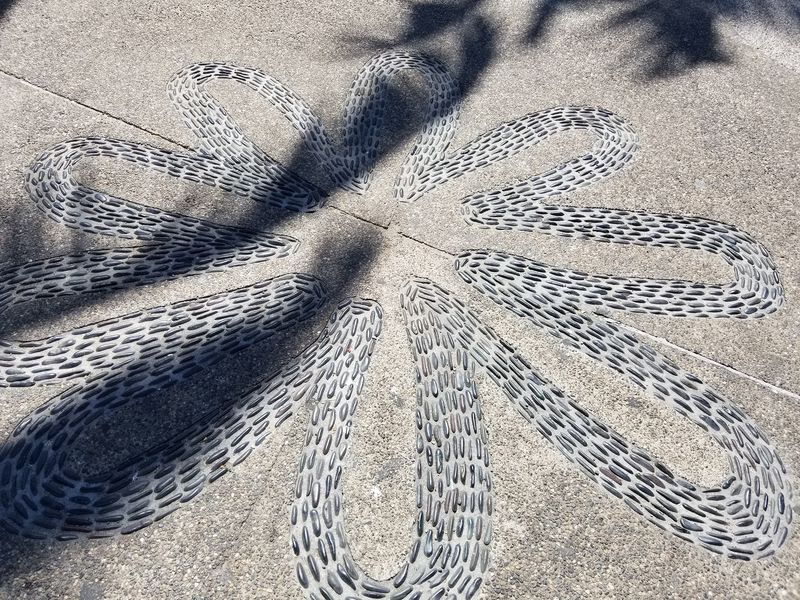 Sidwarlk art made by embedding stones