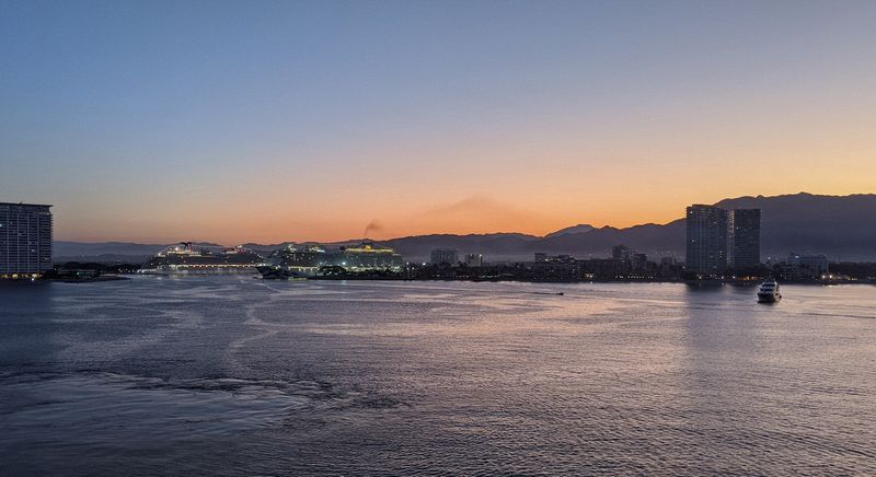 Two ships are already in port as we approach Puerta Vallarta at dawn