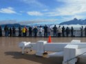 Everyone lines the guard rails to watch
