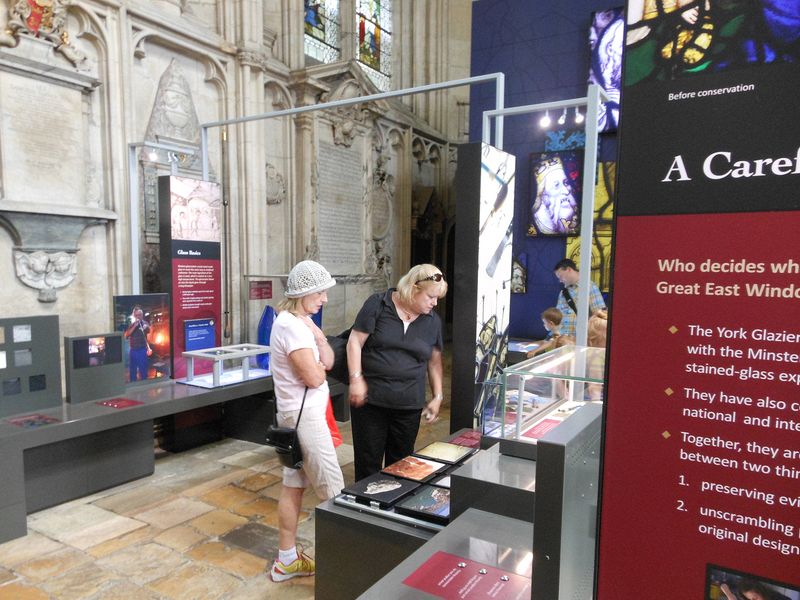 Eloise and Linda read about the stained glass