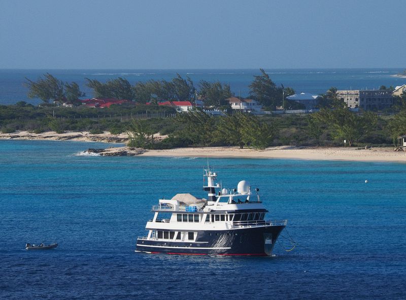 A tour boat anchored near the beach