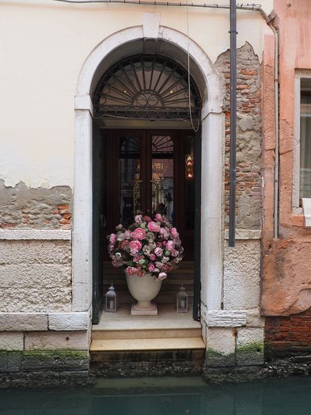 A bouquet in an entryway on a canal