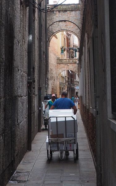 Handcart deliveries through the narrow streets