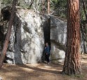 Jen next to a big crack in a huge rock