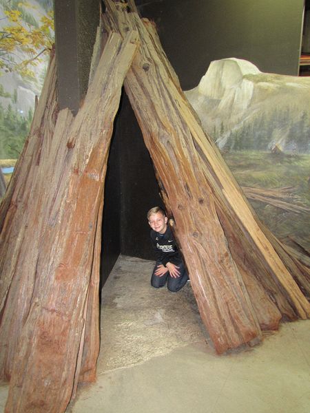 Nicholas in a Native American house