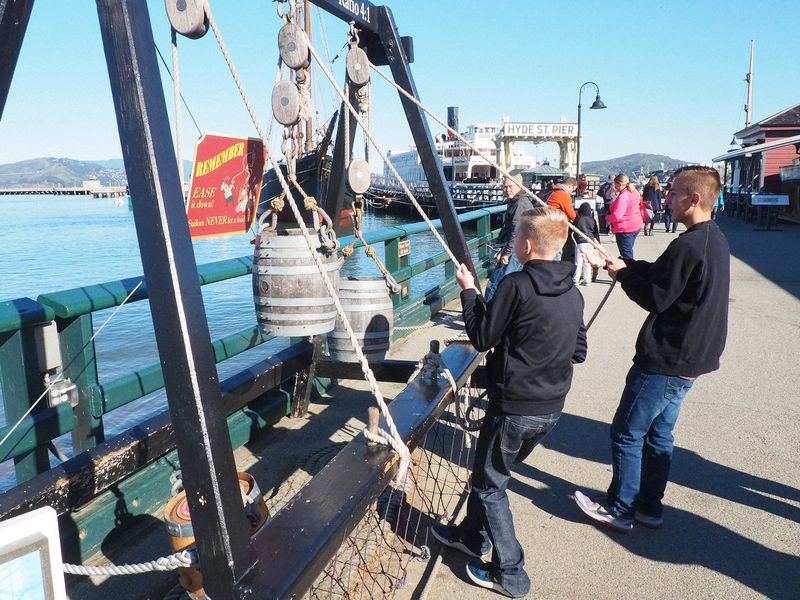 The boys experience a block and tackle at the Maritime Museum