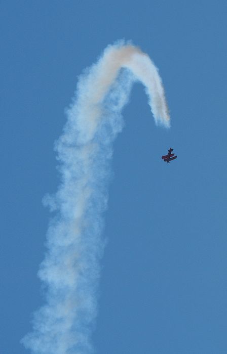 A biplane starts a dive