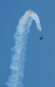 A biplane starts a dive