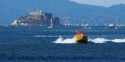 A fast jet boat with Alcatraz in the background