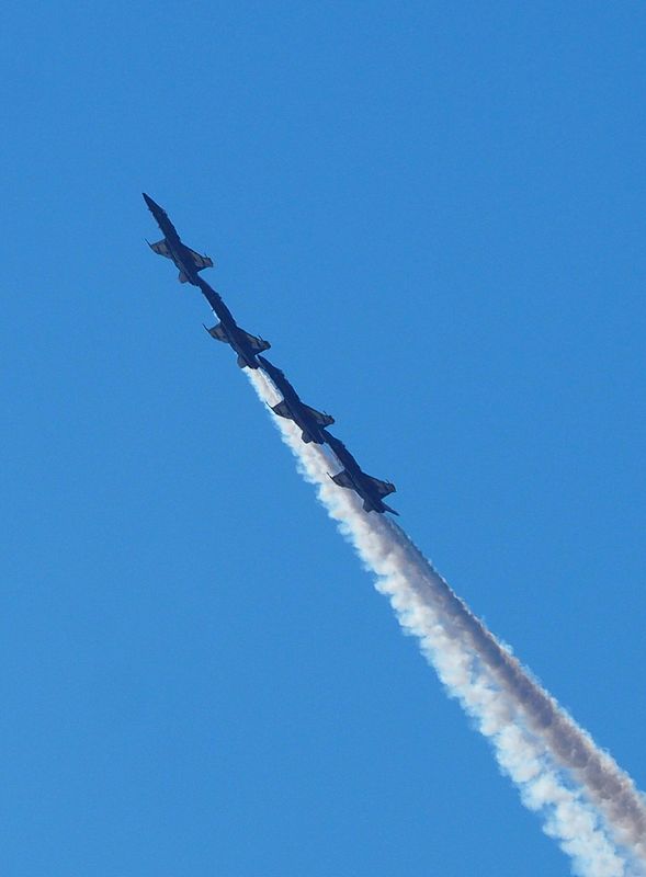 Four Blue Angels climbing