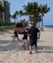 Dave plays tag on the beach with the boys