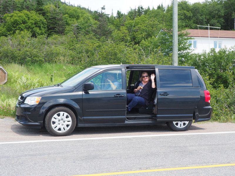 Linda waves from the minivan