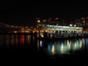 Ferry terminal lights reflect on the water