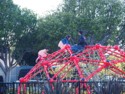 Kids on a climbing structure with Dad