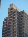 Mottled reflection on a tall building
