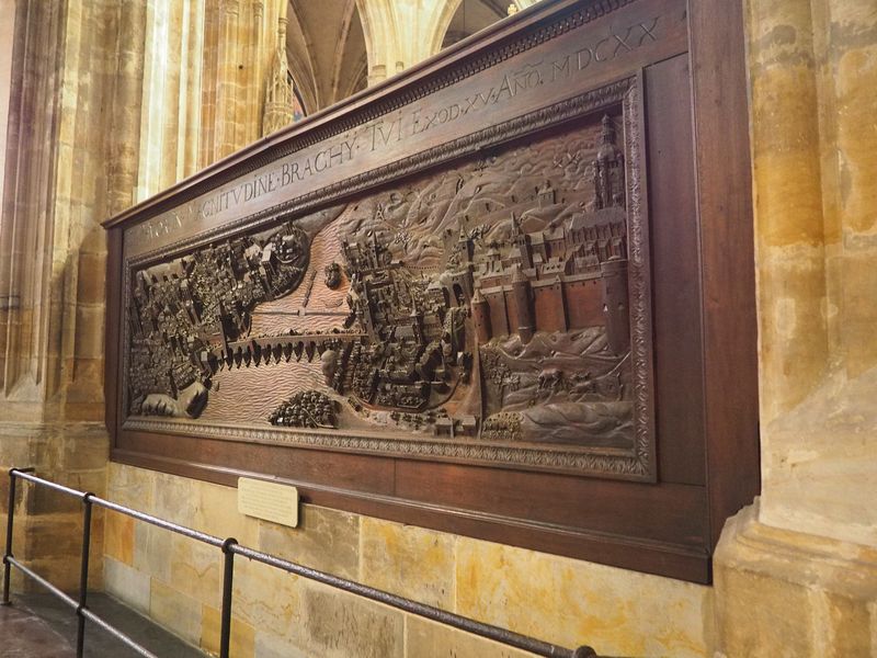 Carving showing the palace and the Charles Bridge
