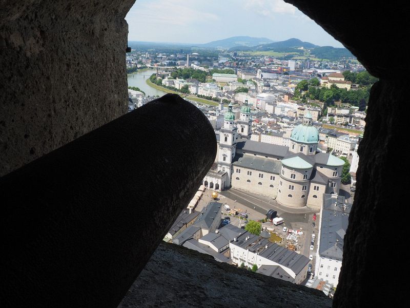 A cannon points across the city