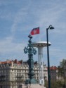 French rooster on pole and university lights