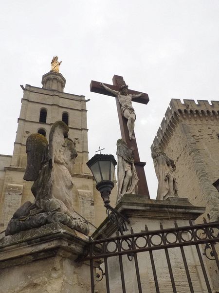 Golden statue of Mary above the cross