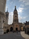 The bell tower with a golden statue of Mary at the top