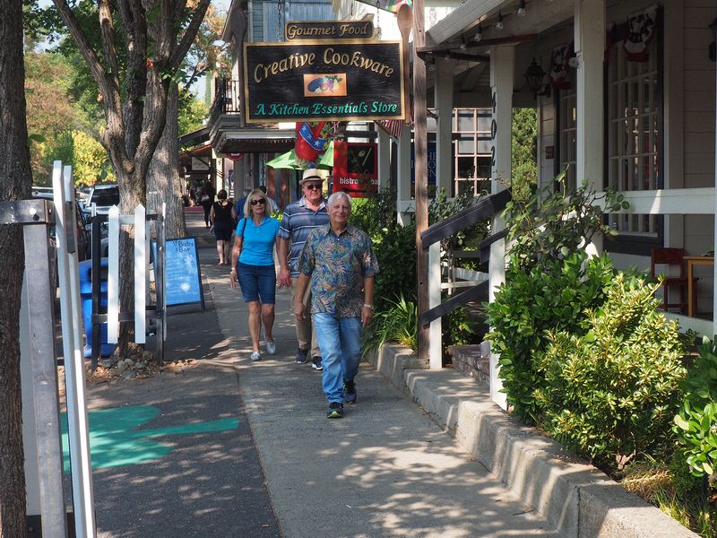 Eloise, Livingston and Ron walk down the street in Murhpys
