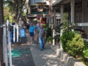 Eloise, Livingston and Ron walk down the street in Murhpys