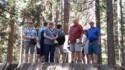 June, Linda, Pete, and Livingston on the big stump of a 1,244 year old tree cut down in 1853